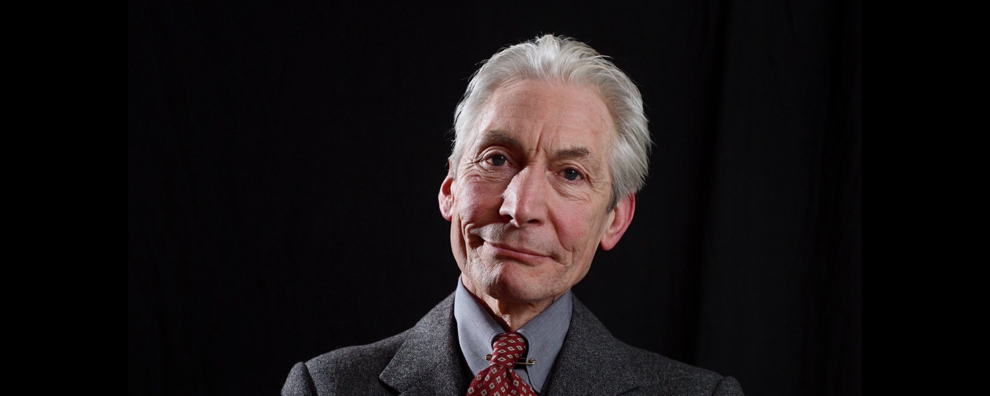 Elton John, Ringo Starr, Paul McCartney & Others Join Bandmates in Honoring Charlie Watts’ Legacy As “The Heartbeat of Rock & Roll”