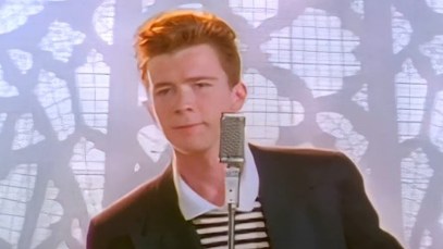 Rick Astley singing "Never Gonna Give You Up" in the song's music video.