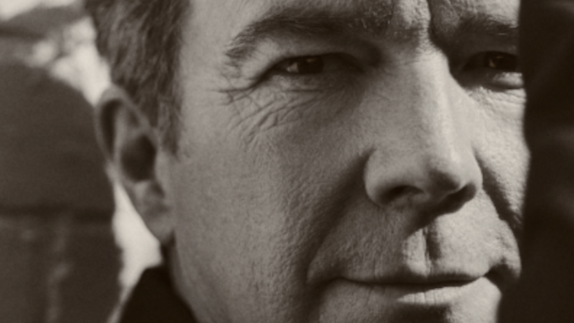 Ricky Astley is pictured looking directly at the camera 35 years after releasing "Never Gonna Give You Up."