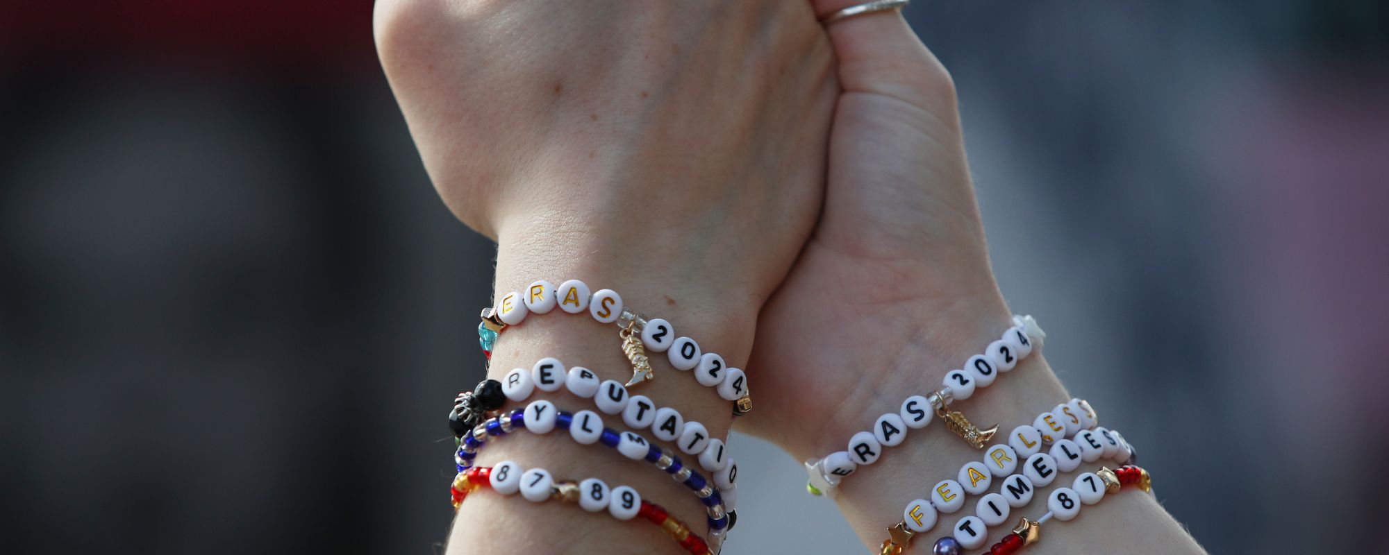 Fans wearing friendship bracelets at Taylor Swift's "Eras" tour in Australia.