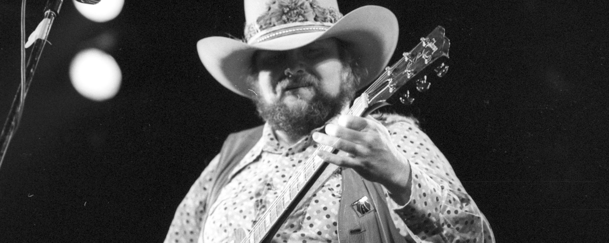 Charlie Daniels playing guitar