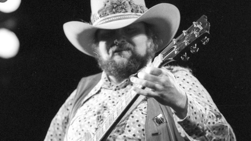 Charlie Daniels playing guitar