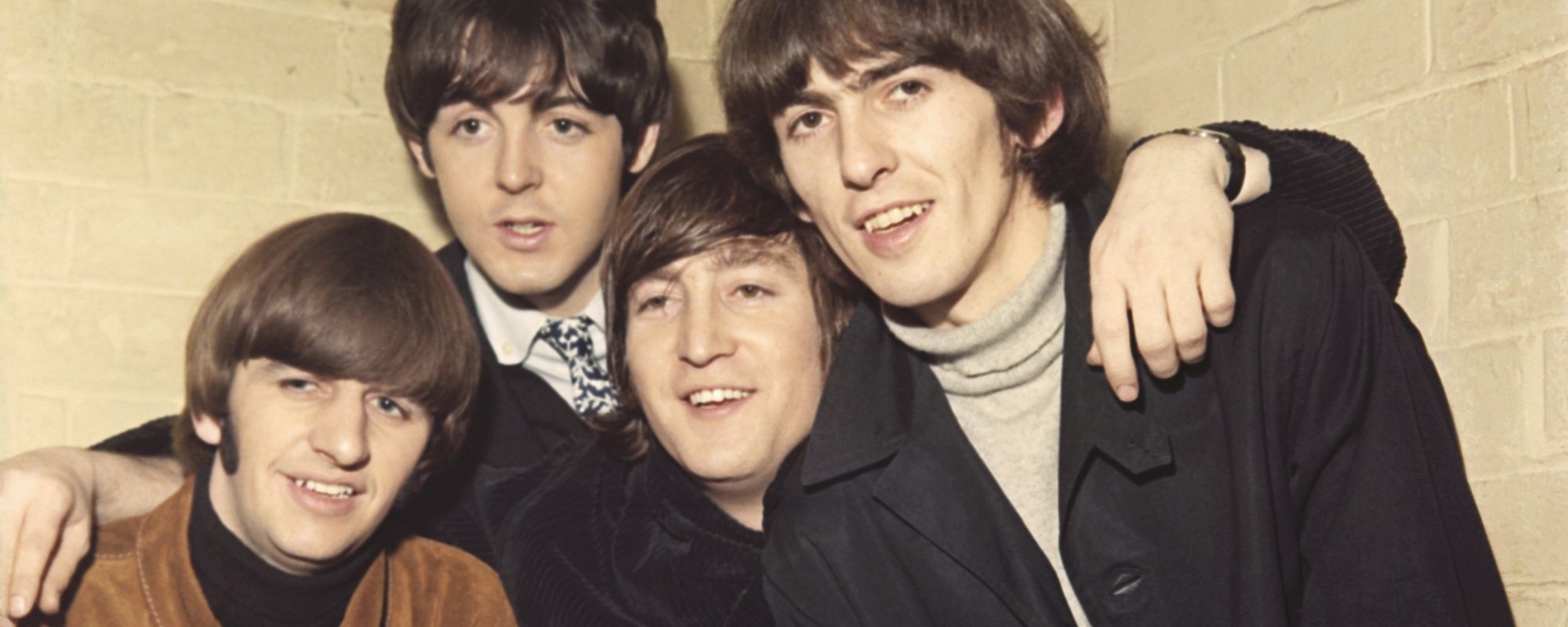 Ringo Starr, Paul McCartney, John Lennon, and George Harrison pose together