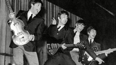 Beatles jumping at concert