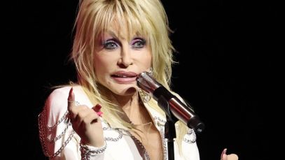 Dolly Parton speaking at microphone