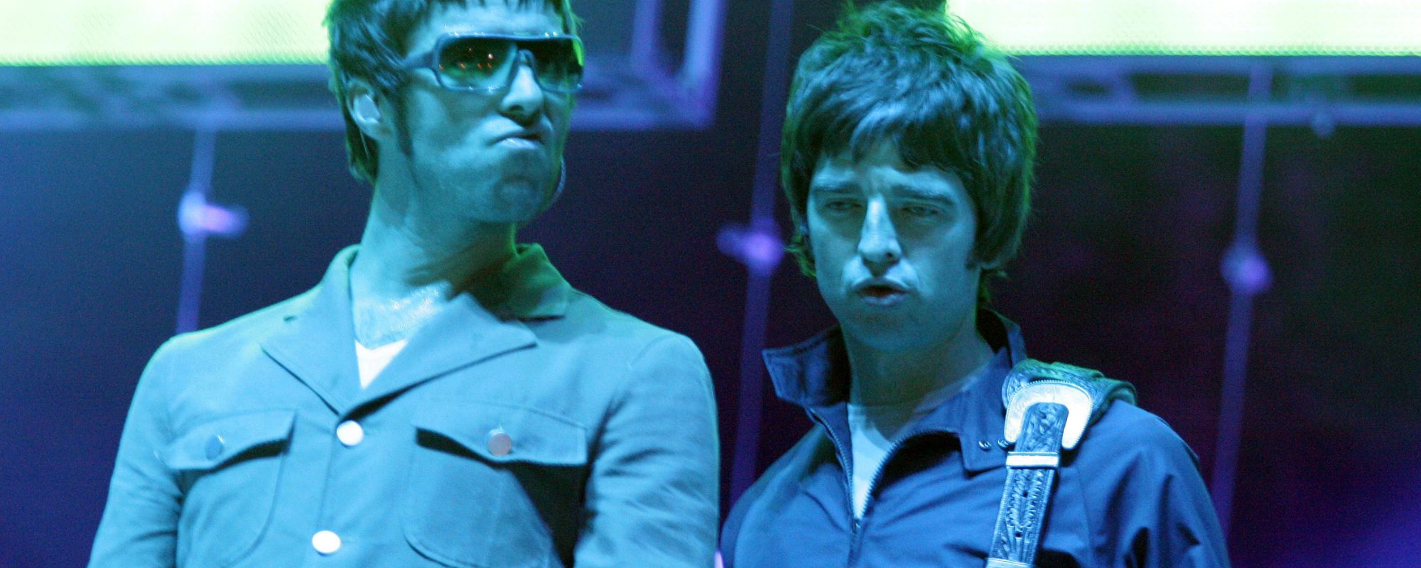Liam and Noel Gallagher on stage