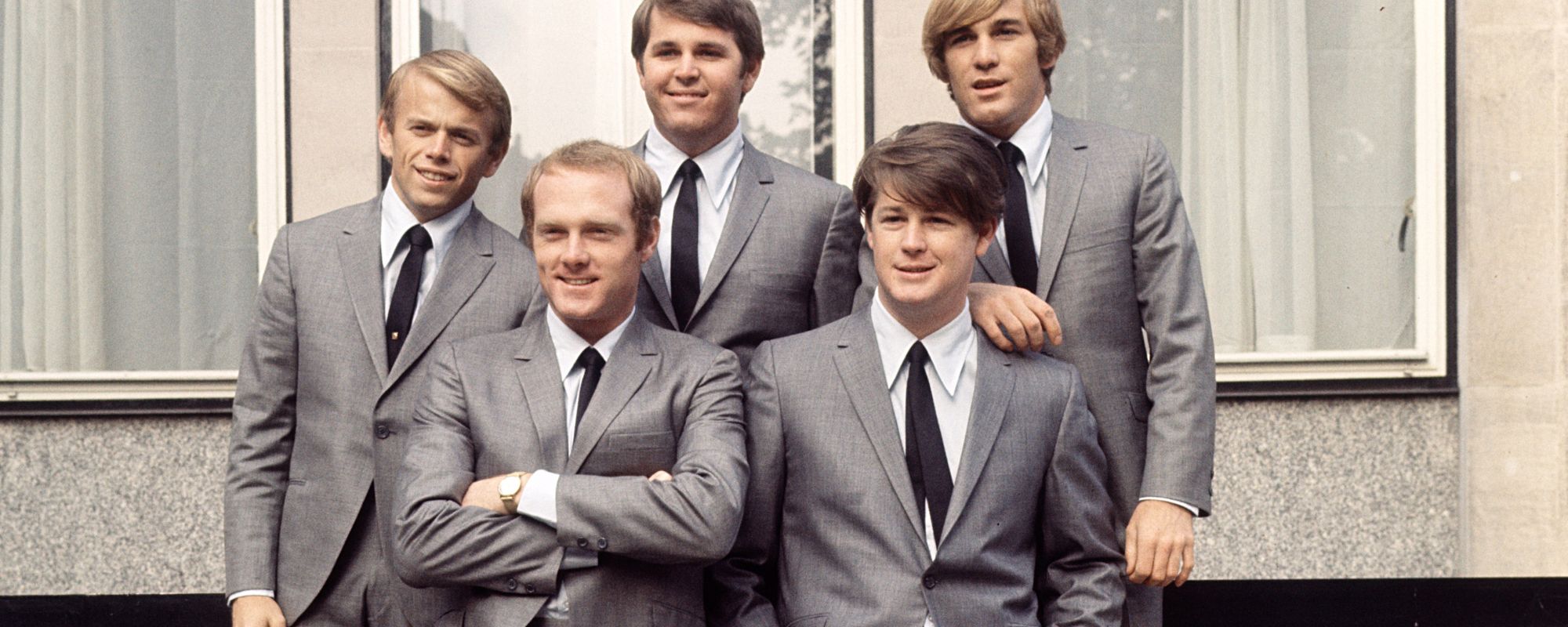Beach Boys pose in suits