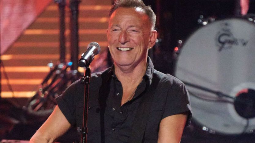 Bruce Springsteen smiling on stage