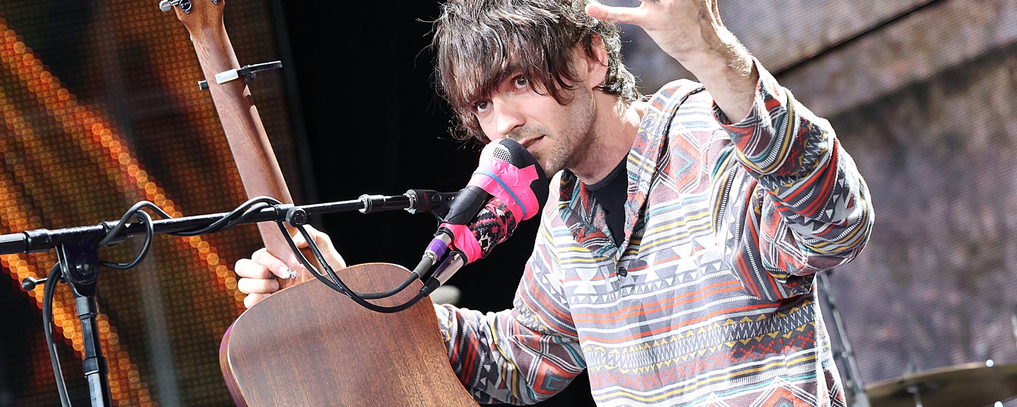 Micah Nelson talking into microphone