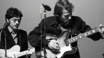 Robbie Robertson and Levon Helm performing
