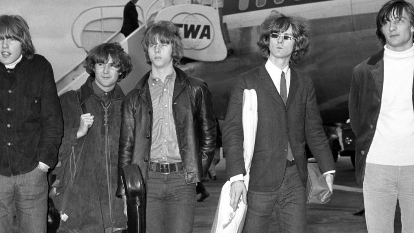 The Byrds walking on tarmac