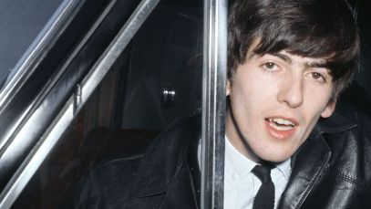 George Harrison leaning out of car window