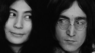 Yoko Ono and John Lennon looking at one another