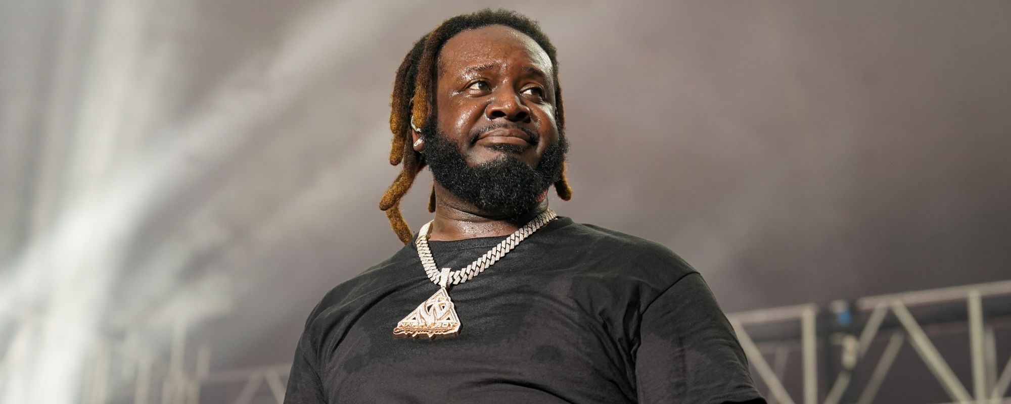 T-Pain scowling on stage