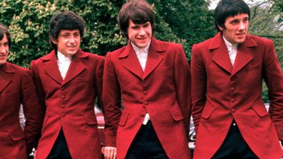 The Kinks posing in matching suits