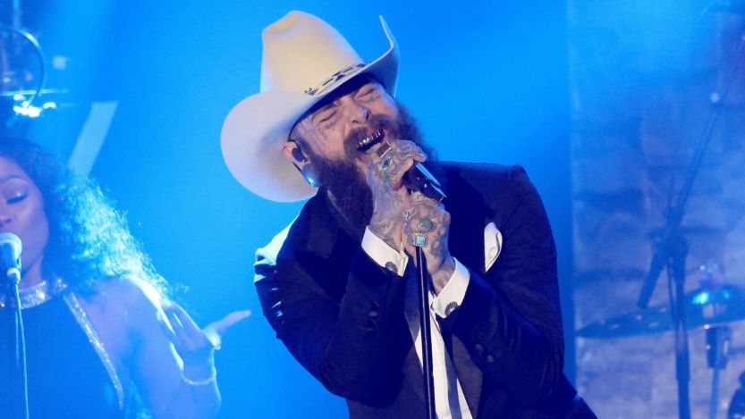 Watch Post Malone Join Travis Tritt To Perform His Classic “T.R.O.U.B.L.E.” at Opry’s 100th Anniversary Special