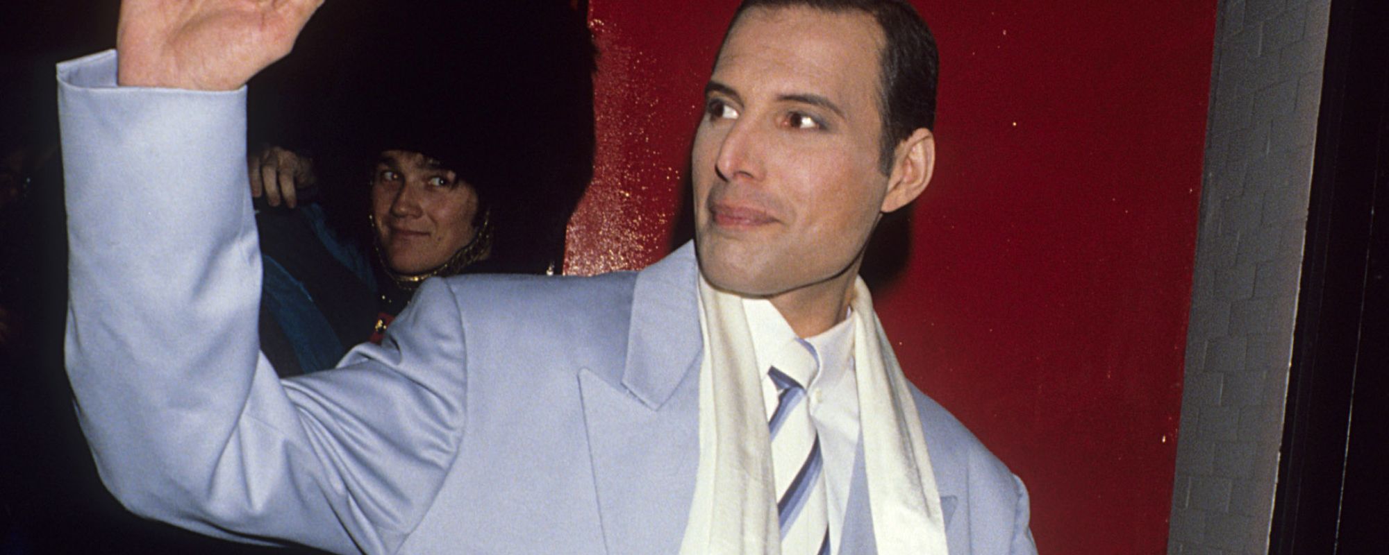 Freddie Mercury waving