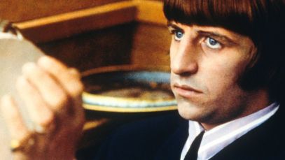 Ringo Starr playing tambourine