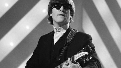 John Lennon playing guitar