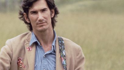 Townes Van Zandt standing in field