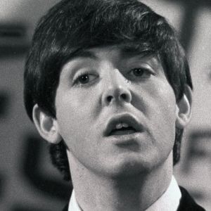 Paul McCartney performing with the Beatles