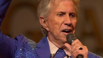 Porter Wagoner speaking into microphone