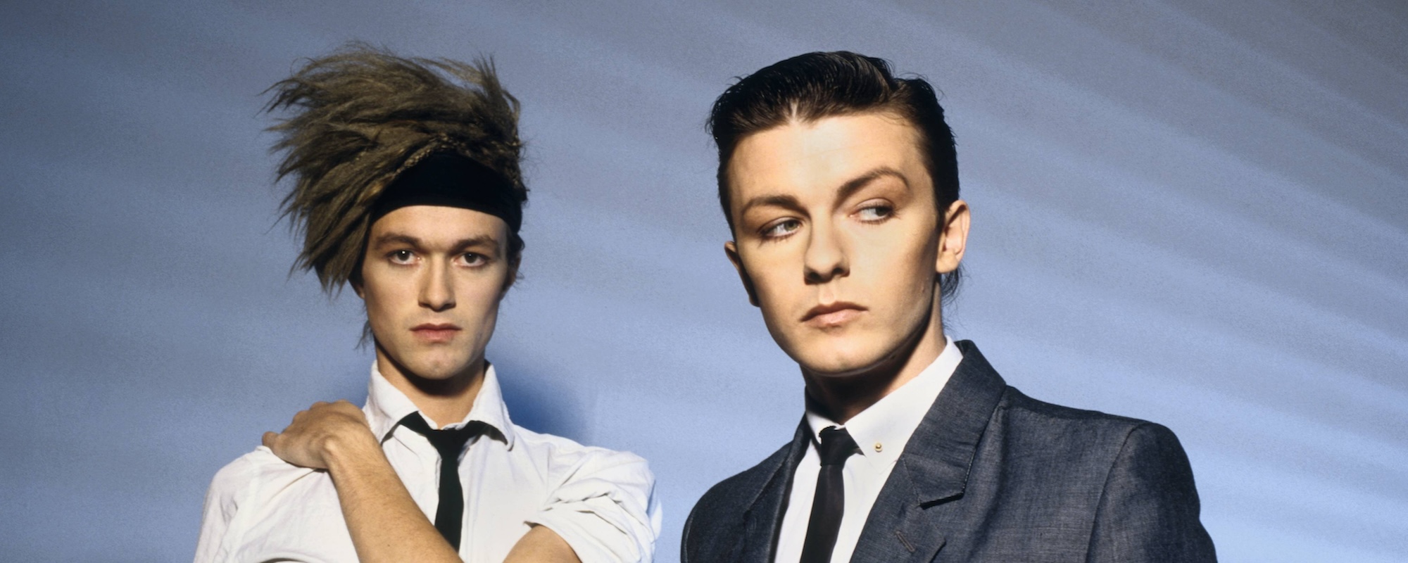 4 Songs Actor and Comedian Ricky Gervais Wrote for His ’80s Synth-Pop Band Seona Dancing, David Bowie, and ‘The Simpsons’