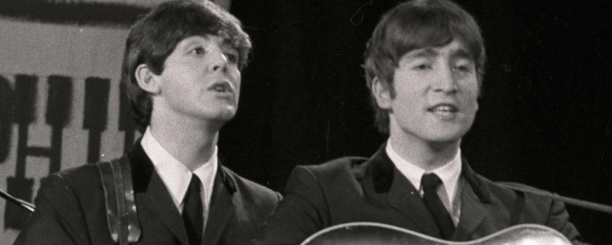 Paul McCartney and John Lennon of the Beatles performing