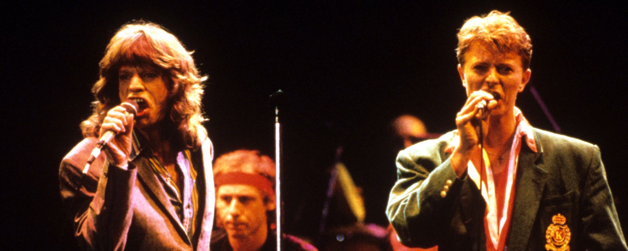 David Bowie and Mick Jagger performing