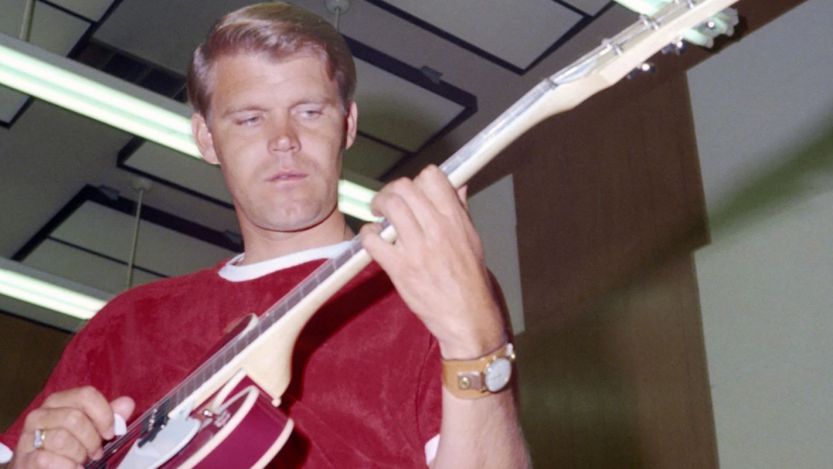 Glen Campbell playing guitar