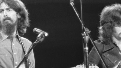 George Harrison of the Beatles and Eric Clapton performing