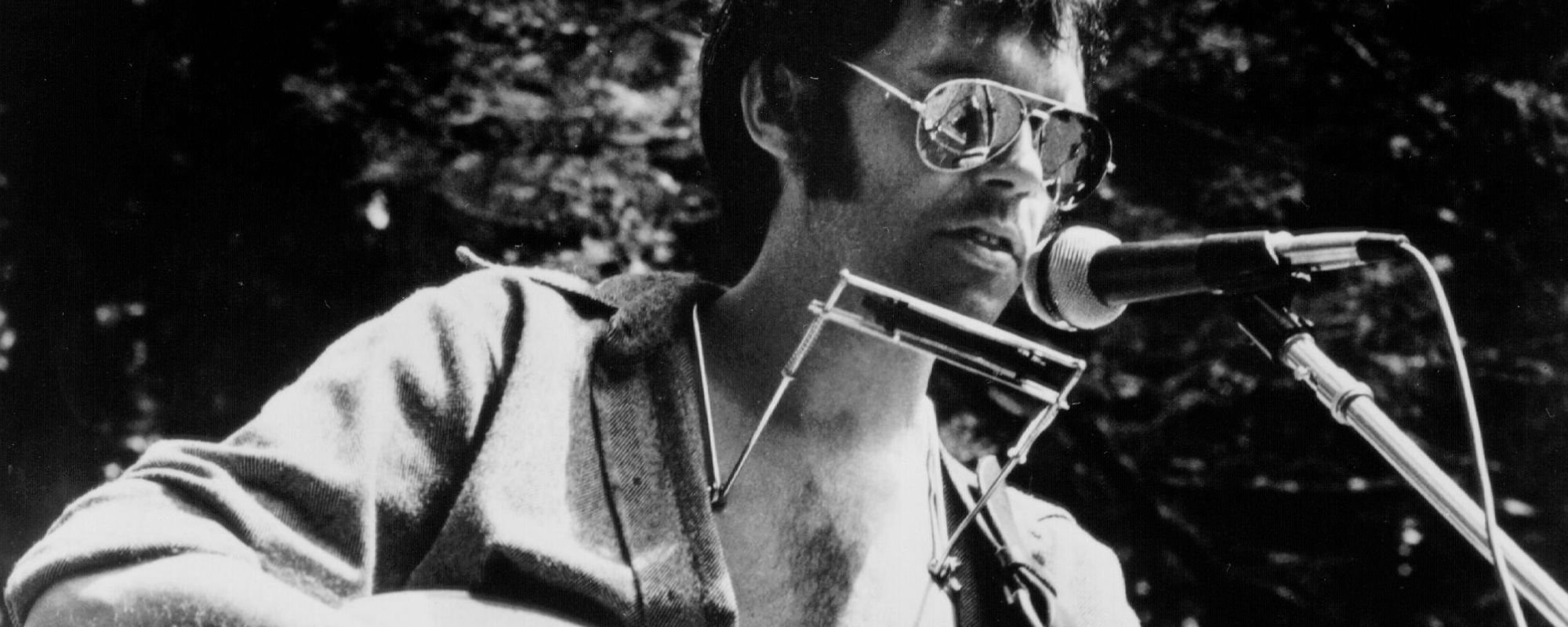 Neil Young performing on outdoor property