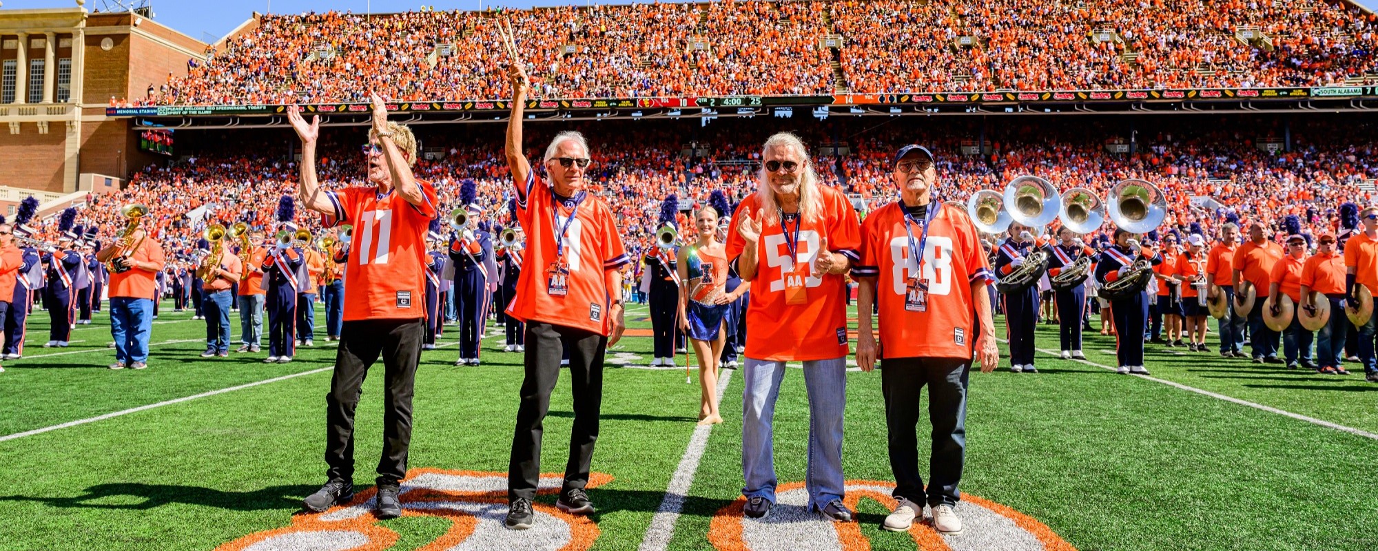 Watch REO Speedwagon Members Reunite for Special Performance With College Marching Band at Football Game