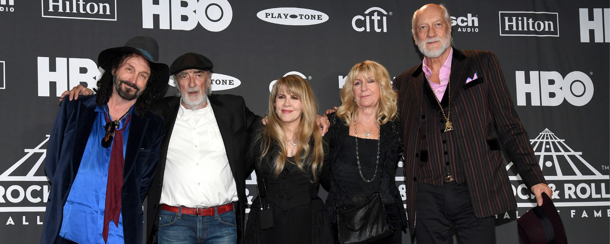 Fleetwood Mac standing next to Mike Campbell
