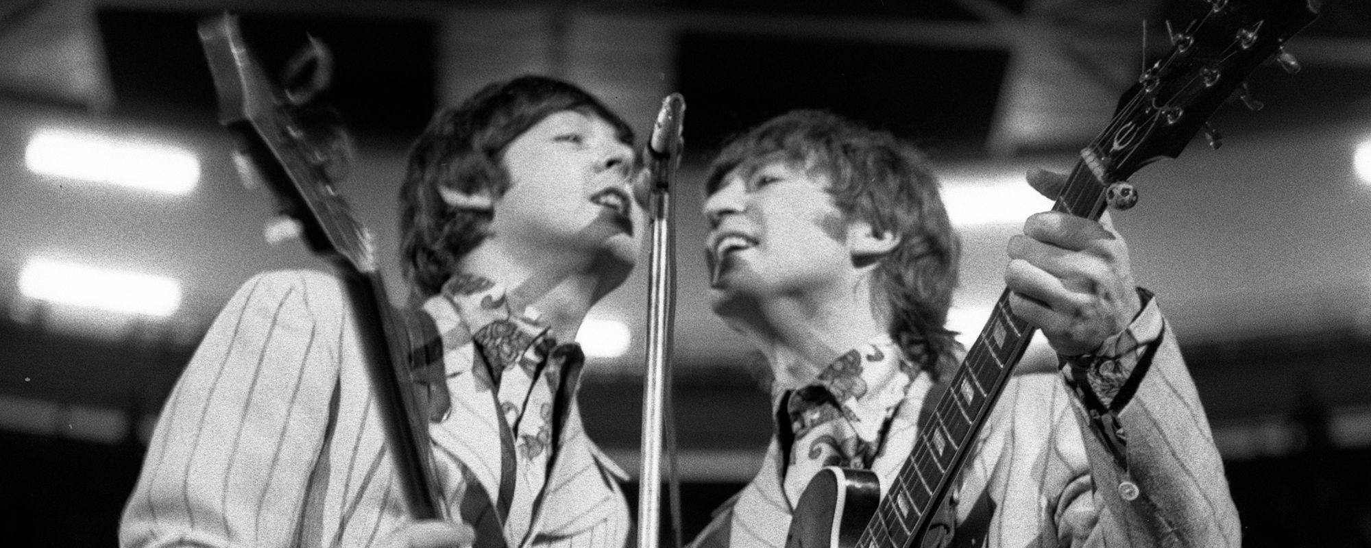 Paul McCartney and John Lennon performing