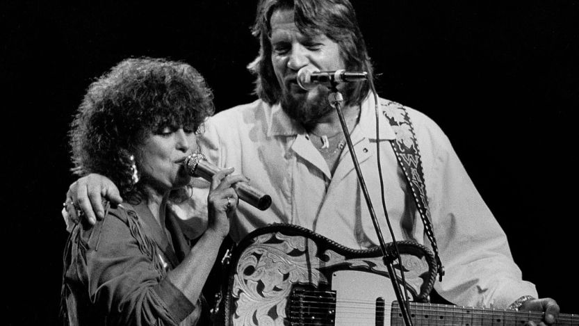 Waylon Jennings and Jessi Colter performing