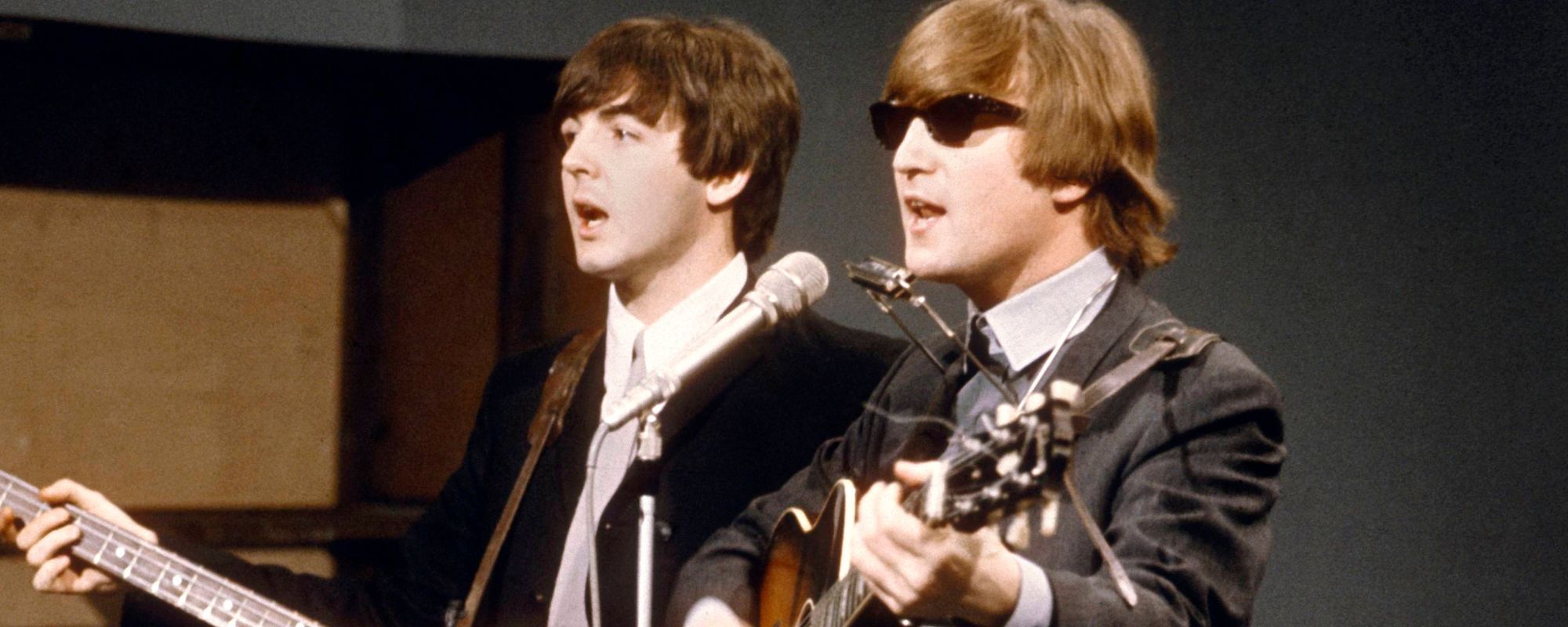 Paul McCartney and John Lennon of The Beatles performing