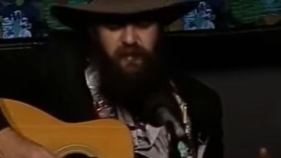 Blaze Foley playing guitar