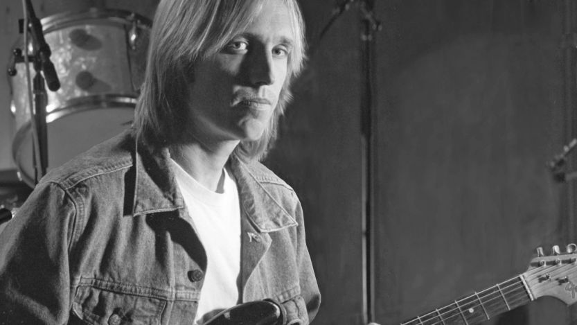 Tom Petty posing with guitar