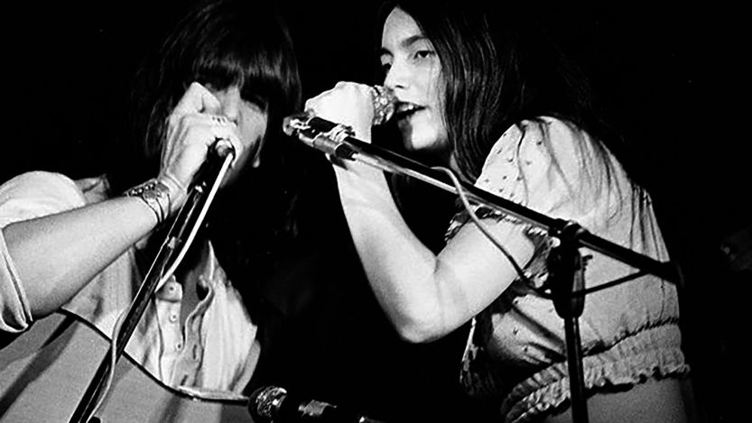 Gram Parsons and Emmylou Harris performing