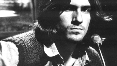 James Taylor playing guitar